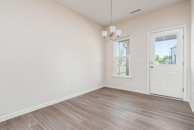 Building Photo - End unit townhome loaded with upgrades close to RTP! Available: Now