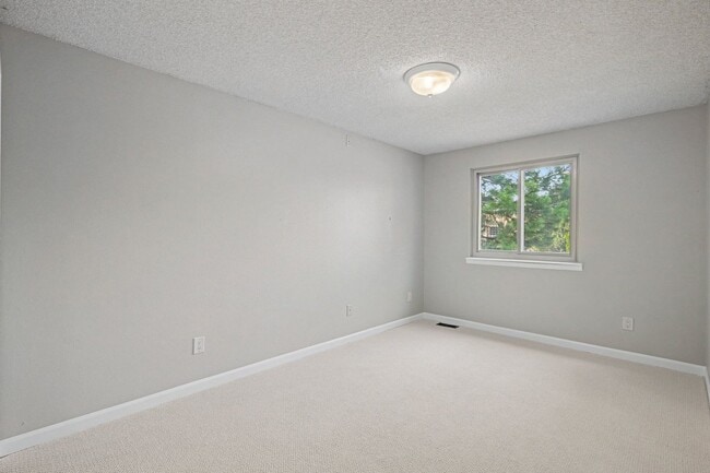 Building Photo - Updated 4BR Corner Lot Home with Finished Basement & 2-Car Garage