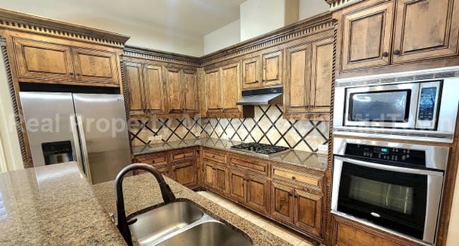 Building Photo - Well-Planned 4BR/3BA—Space for Guests, Off...