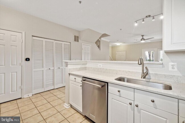 Building Photo - This townhouse style condo is located across the street from the Vienna Metro Station (Orange Line).