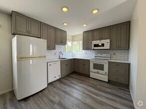 Building Photo - MOVE IN READY studio w/appliances + utilit...