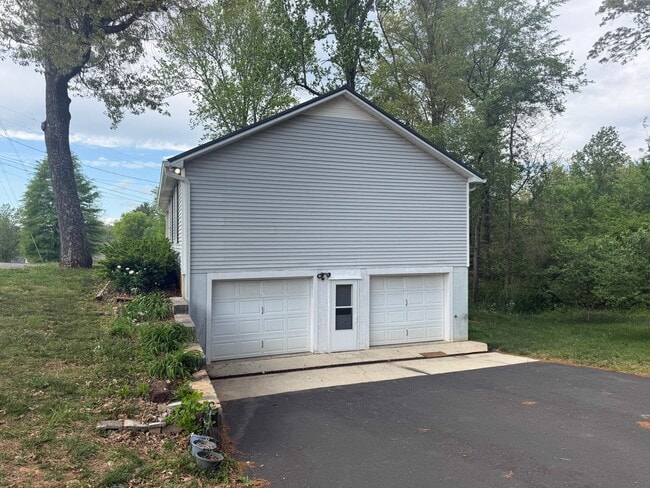 Building Photo - Spacious 3-Bedroom Home with Screened Porch, 2-Car Garage + Workshop