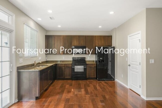 Building Photo - Charming Townhome with Open Layout, Back Patio & One-Car Garage – Near RTP, RDU & Everyday Conven...