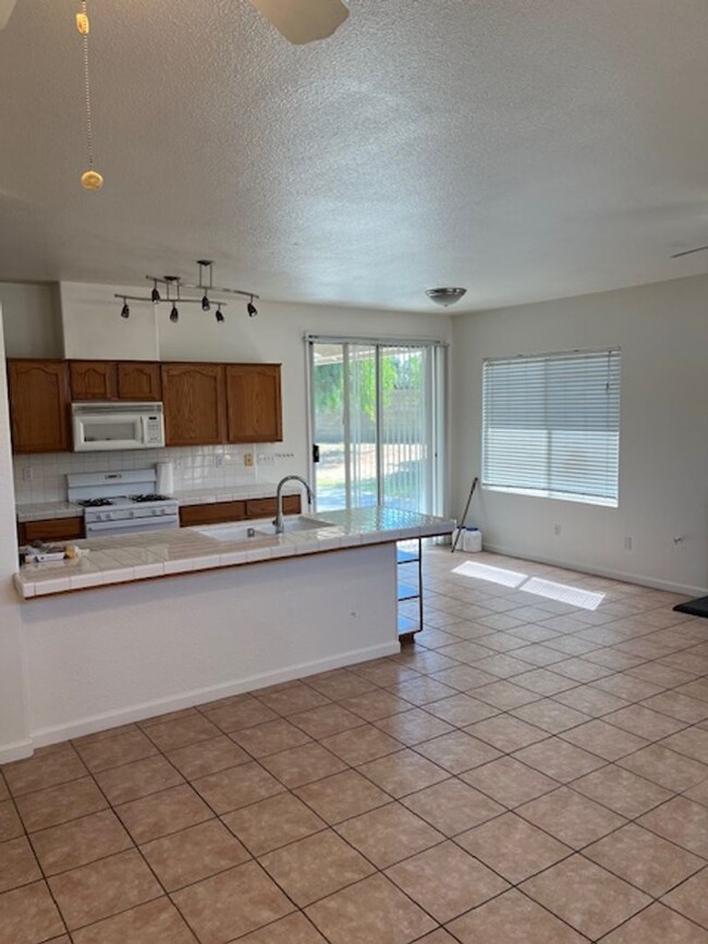 Building Photo - 4 Bedroom, 2 Bathroom Home with a Pool in ...