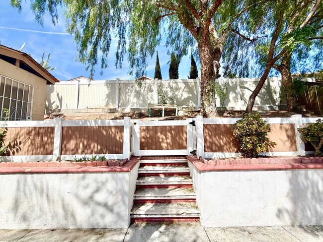 Building Photo - Spacious 5 Bedroom 3 Bathroom Home with Updated Paint, New Roof & Private Balcony