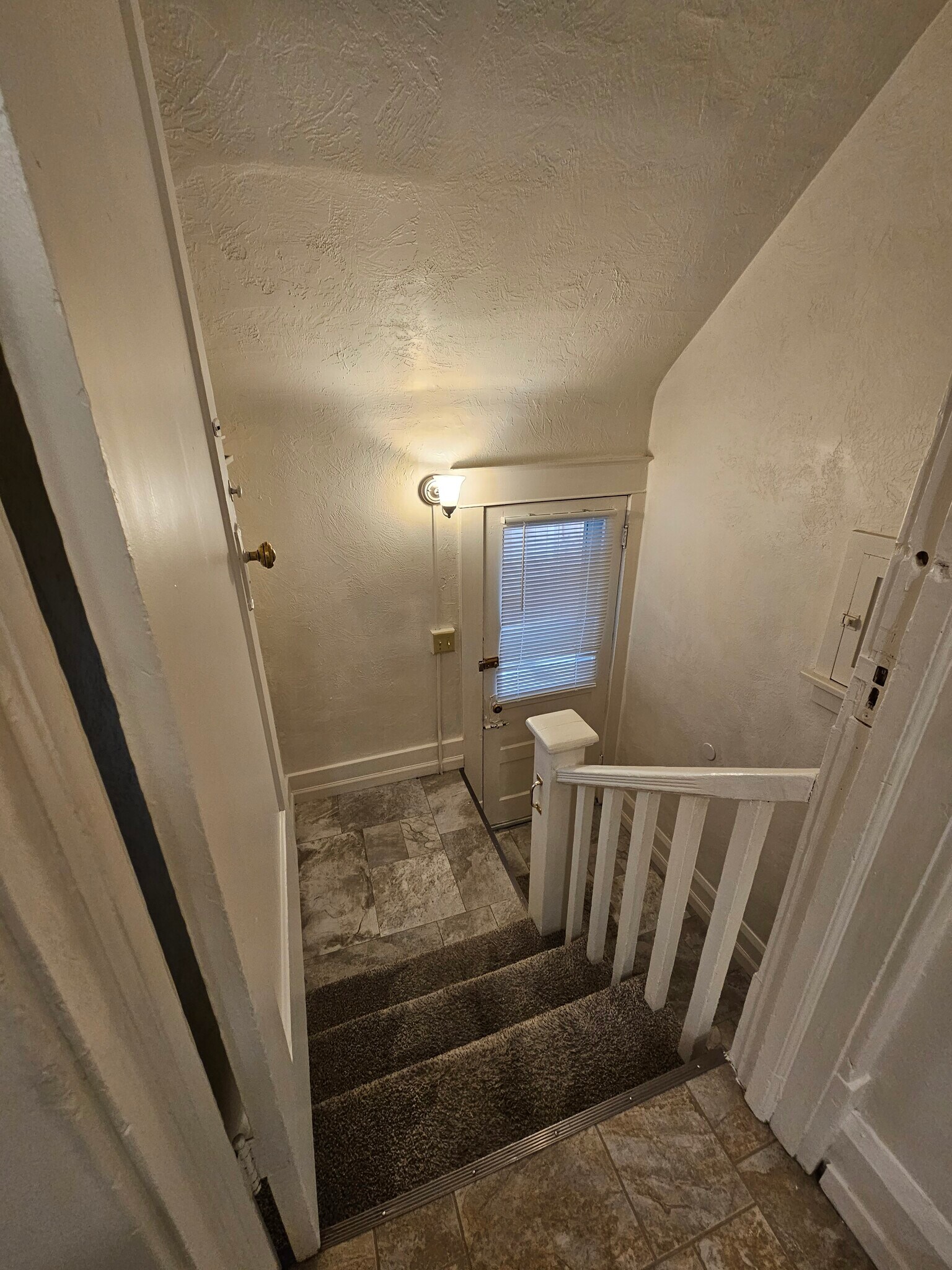 Stairs to backdoor & bedrooms - 110 12th St N