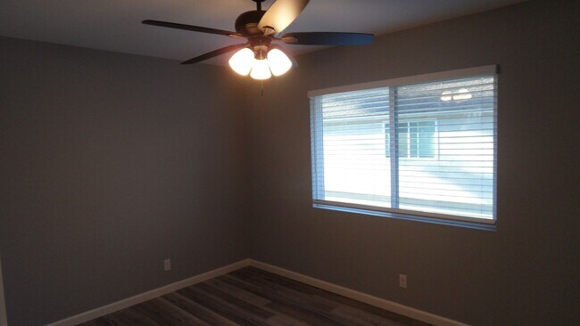 Building Photo - REMODELED 2BR; 1BA end unit condo w/ 1 car garage & 1 parking space