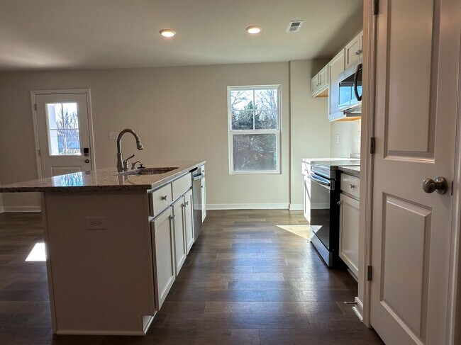 Building Photo - Modern New 3BR Townhome in Hancock Village with Luxury Finishes