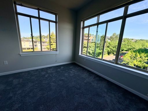 Building Photo - Top-Floor Corner 2BR with Lake Union Views + Garage Parking Included!