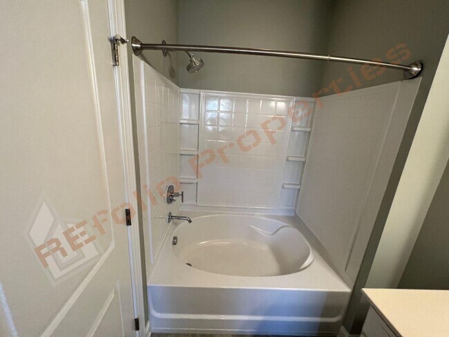 Building Photo - Elegant 3 Story 3 Bedroom Formal Model Tow...