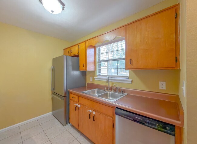 Building Photo - LOVELY & Modern NW 2/1 w/ New Flooring & Huge Privacy Fenced Yard that Inc Lawn Maintenance! Avai...