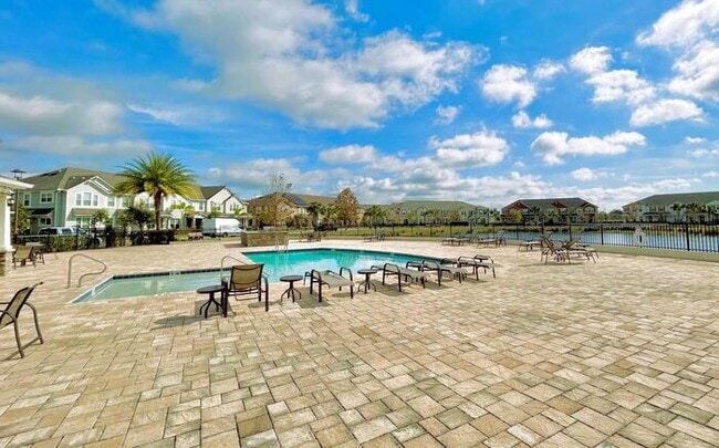 Building Photo - Luxurious 3/2.5 Modern Townhome with a Private Balcony and a 2 Car Garage in the Exclusive Gated ...