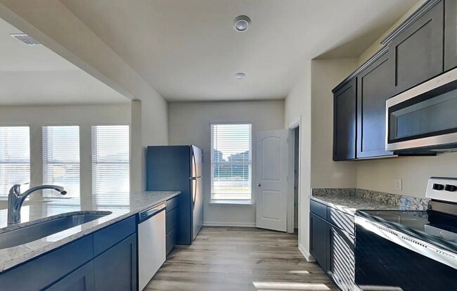 Building Photo - Spacious 4-Bedroom House with Cozy Living Spaces