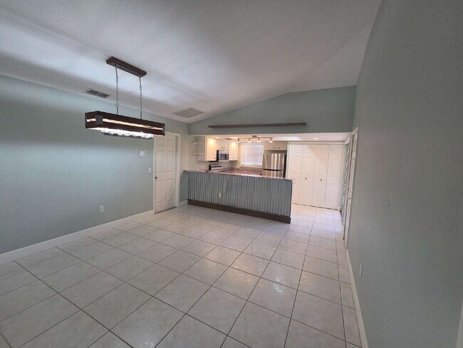 Building Photo - "Charming 2-Bed, 2-Bath North Port Retreat with Gleaming Hardwood Floors!"