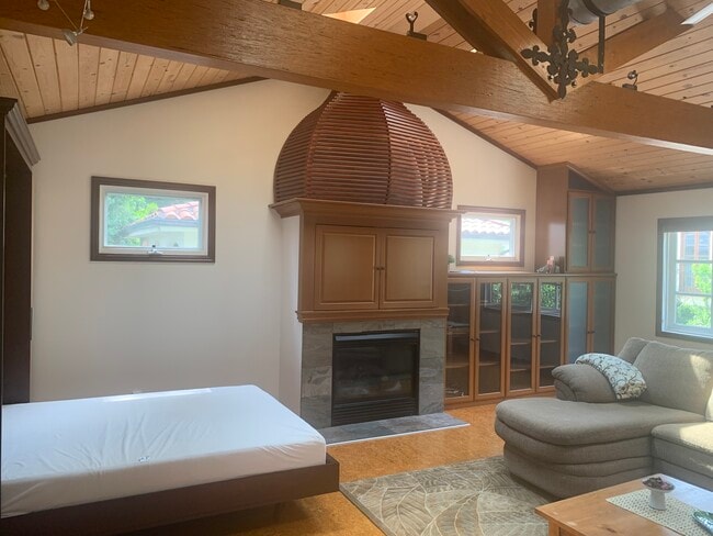 Bed, TV in Cabinet, Fireplace and large Bookshelf - 14715 Greenleaf St