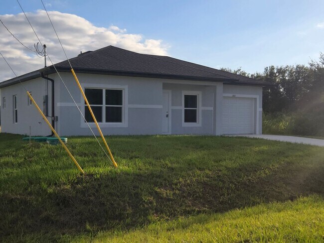 Building Photo - Brand-New 2/2/1 -SW Lehigh Acres-See this ...