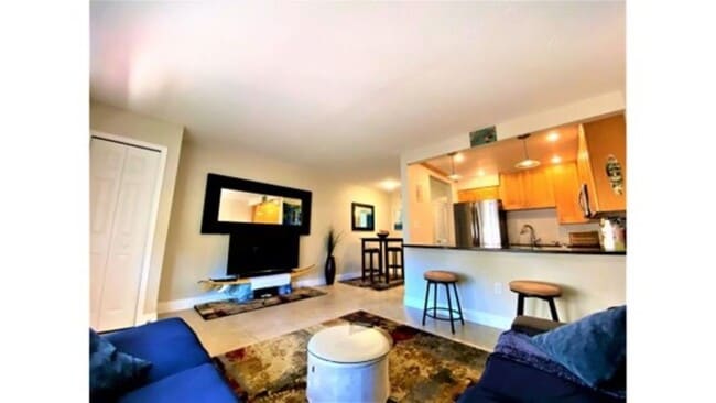 Living Room with Large Flatscreen and Surround Sound - 7801 Ridgewood Ave