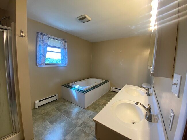 Building Photo - Beautiful secluded 4 bedroom 2.5 bath home with 2 stall detached garage and descent sized yard