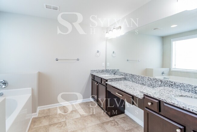 Building Photo - Embrace the charm of this 4 BR, 2.5 BA home