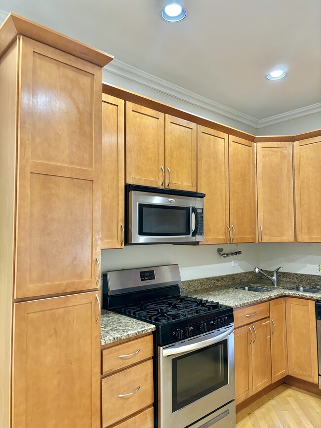 Tall maple wood cabinetry - 1618 S Washtenaw Ave