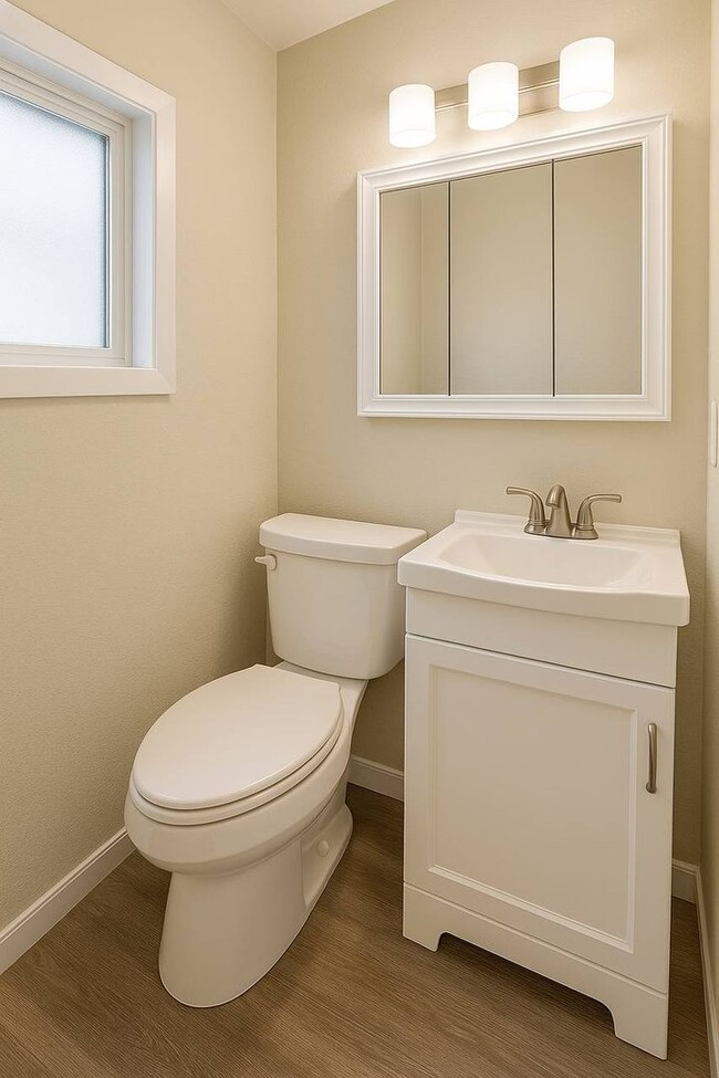 Building Photo - Updated 1-brm home - huge living room, brand new flooring, washer/dryer, new kitchen, new bathroo...