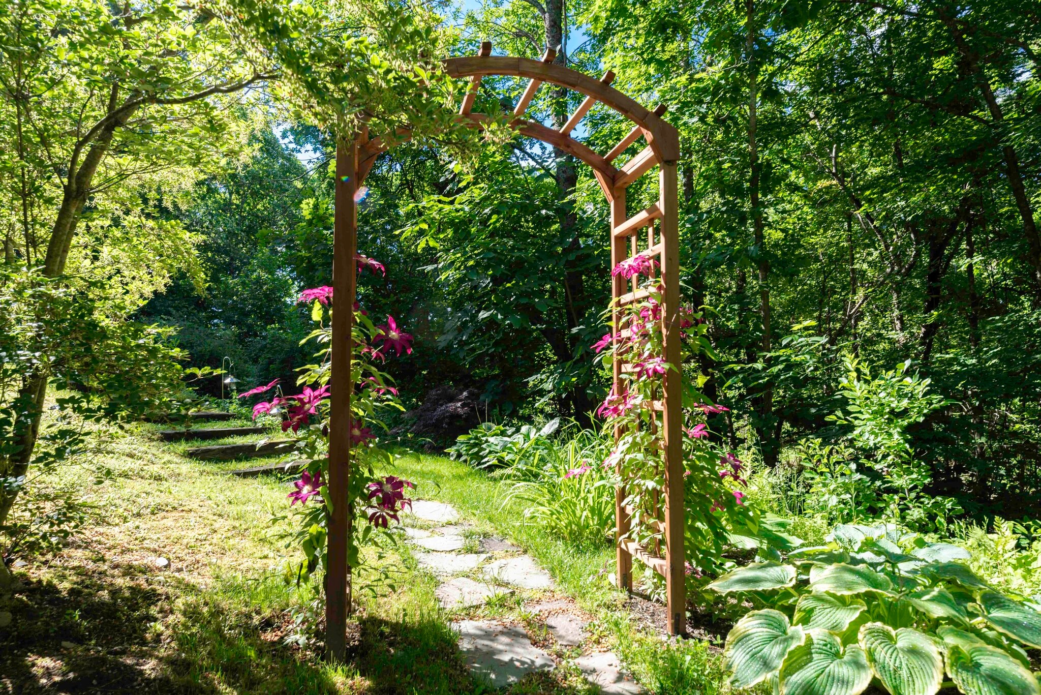 Private entrance with gardens and a stone path - 103 Jennie Ln