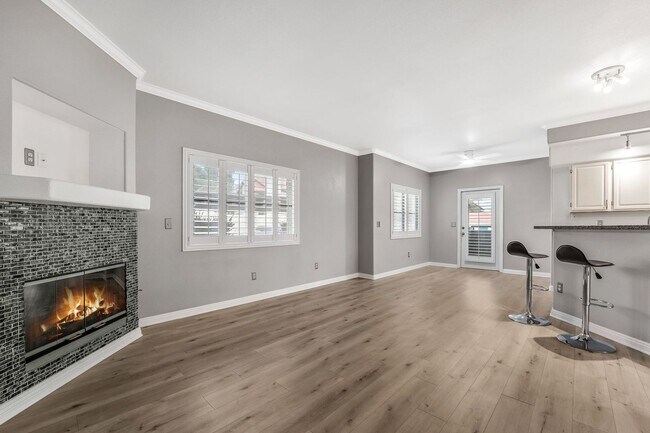 Building Photo - Light-Filled Dual-Suite Condo with Soaring Ceilings, Fireplace & Private Balcony in Amenity-Rich ...