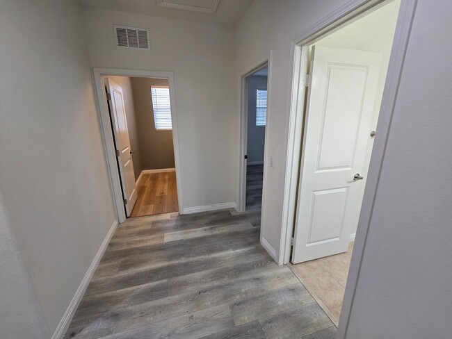 Building Photo - Open-Concept Living with Downstairs Bedroom & Enclosed Patio Retreat