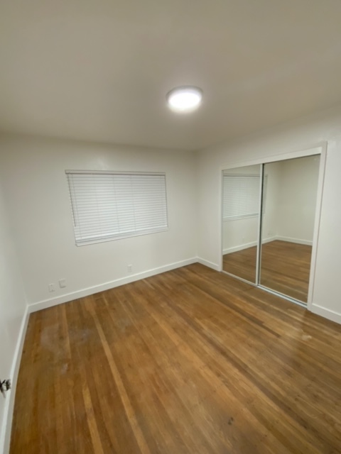 Bedroom w/mirrored closet doors - 300 S 36th St