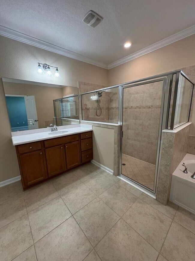 Building Photo - COMING SOON! Beautiful 4BR 3BA Home w/ Screened Lanai & Pond View • Garage Parking • Fenced Yard ...