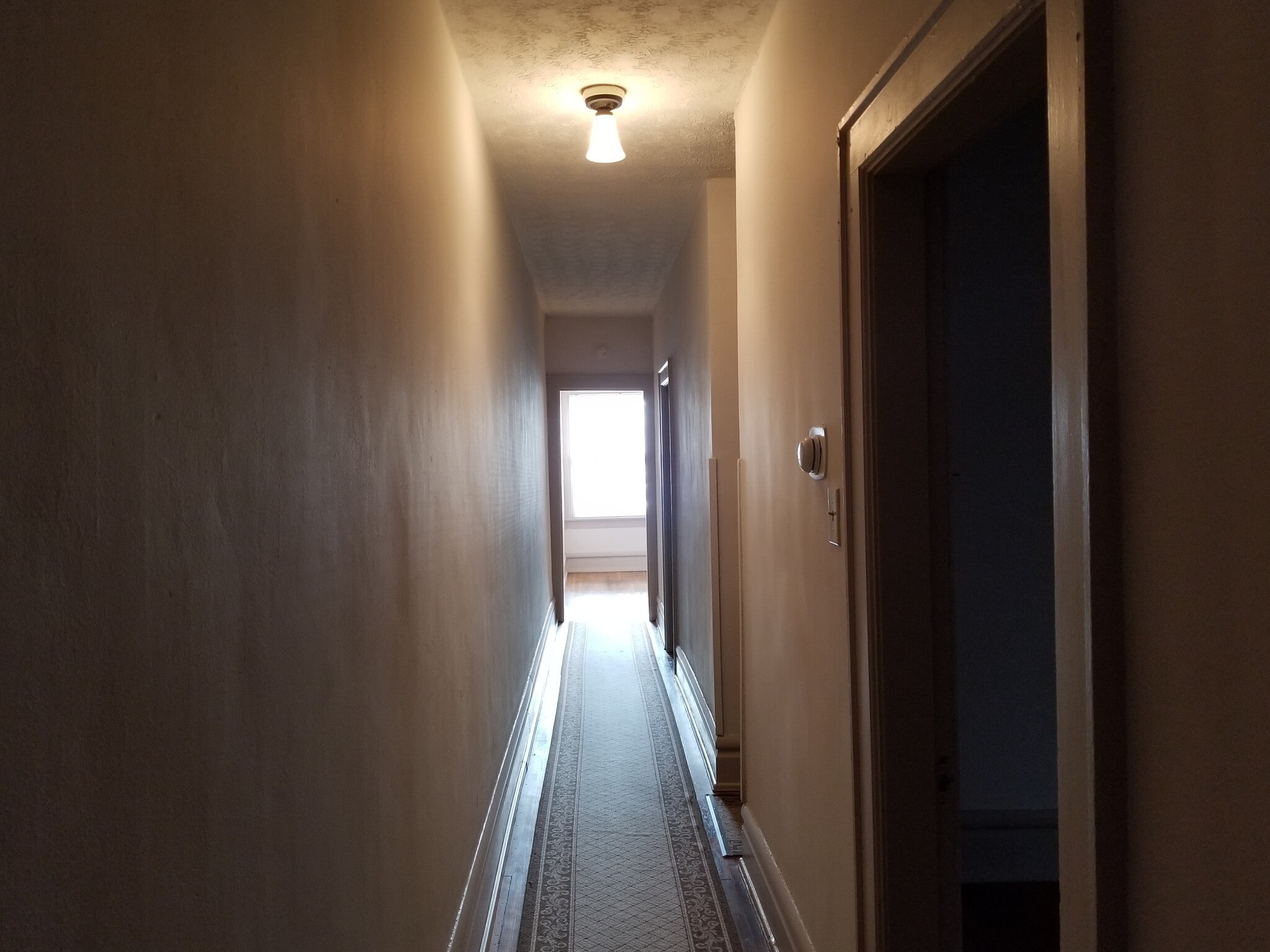 Hallway off of which both Bedrooms and Bathroom run. - 143 W 1st Ave