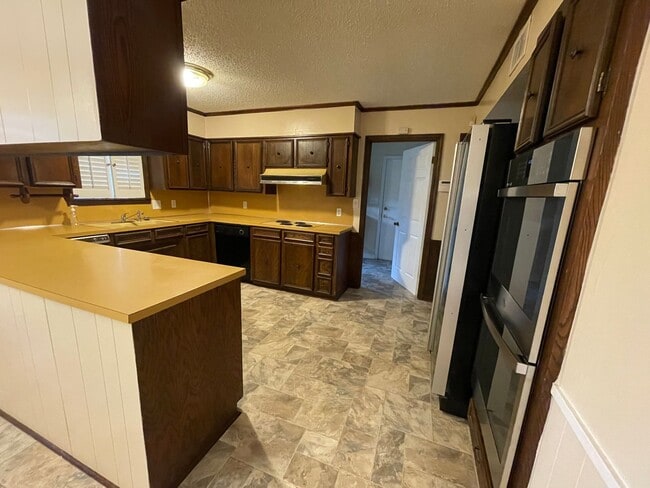 Building Photo - Lovely Two-Story Brick Home Located In "Western Hills" Off Pines Road