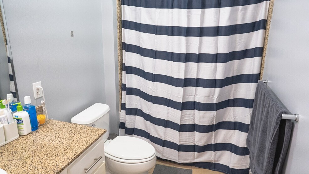 Full bath with toilet, shower and bath tub. Toilet includes bidet shower. - 375 Kirkland Ave