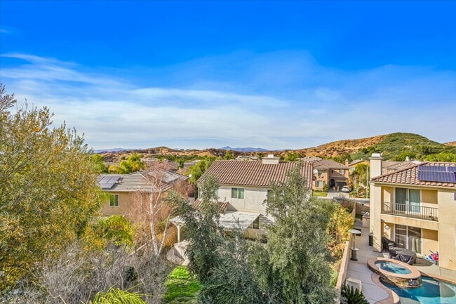 Building Photo - "Spacious 4-Bedroom Retreat with Cozy Fire...