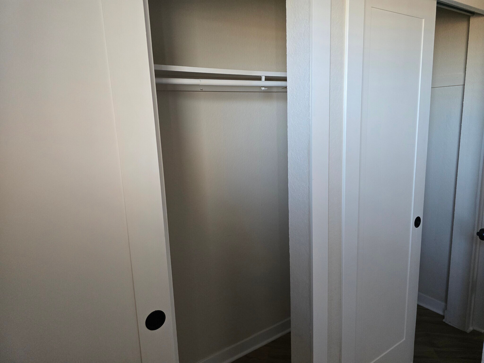 Queen bedroom closet. - 902 S Zephyr Ct