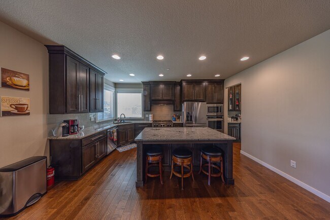 Building Photo - Four Bedroom Home + Bonus & Den in Gated C...