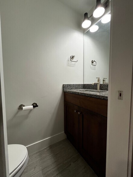 Half bathroom for guests on the main level. - 361 W Reed Ave