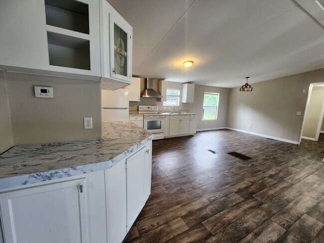 Building Photo - 3 bed, 2 bath w/ Front & Back Decks, 1/4 Acre of land, FENCED backyard