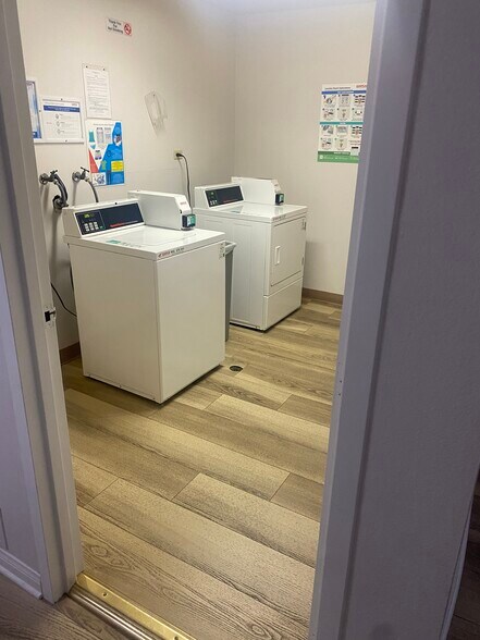Convenient shared laundry room in building - 8305 Summertime Ln