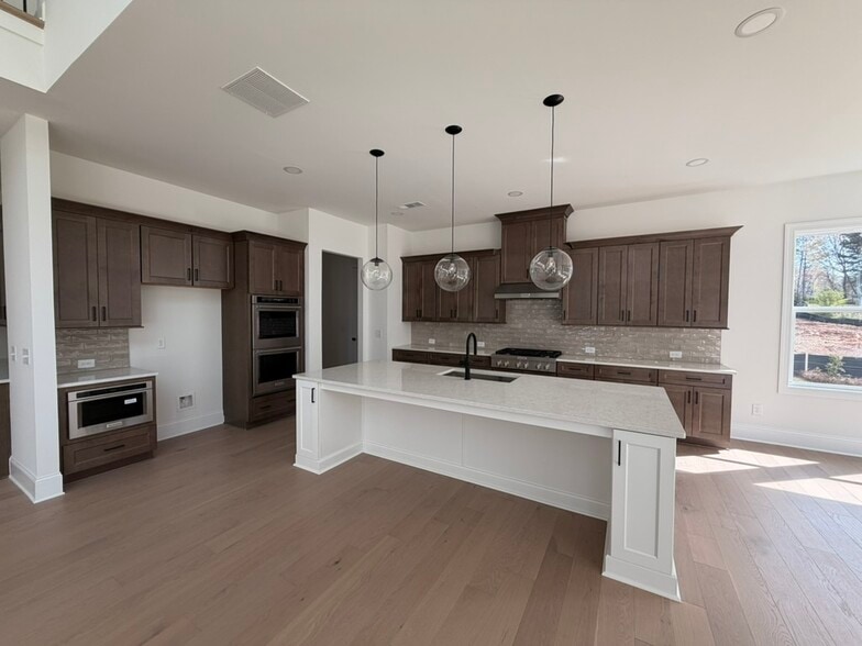 Kitchen with island - 3465 Austin Michael Ln