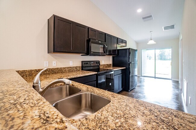 Building Photo - Brand New Beautiful 3/2 Energy Efficient 1...