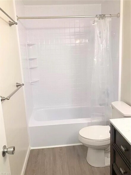 Full bath upstairs. This is *not* an actual picture of the property. This is a picture of an identical unit in the same complex with similar finishes. Actual photos will be uploaded after 4/1/21 when the new carpet is installed. - 1005 Willow Green Dr