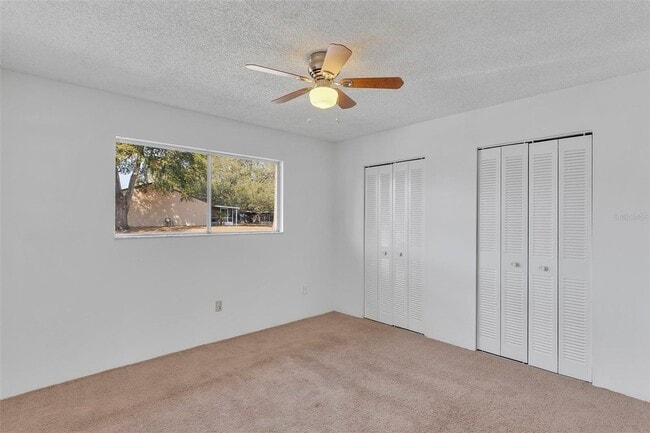 Building Photo - Comfortable & Spacious 3BR Condo with Built-In Closets and Backyard Patio in Tavares Community