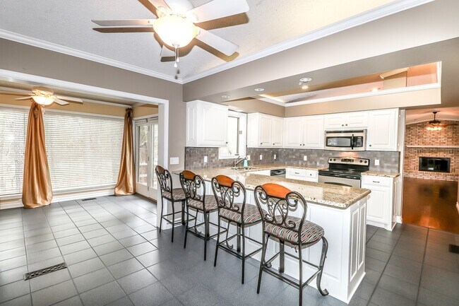 Building Photo - Beautiful 4 Bedroom, 3 Bath home. It has a 2 car garage plus a 1 car carport.  Stay warm in the w...