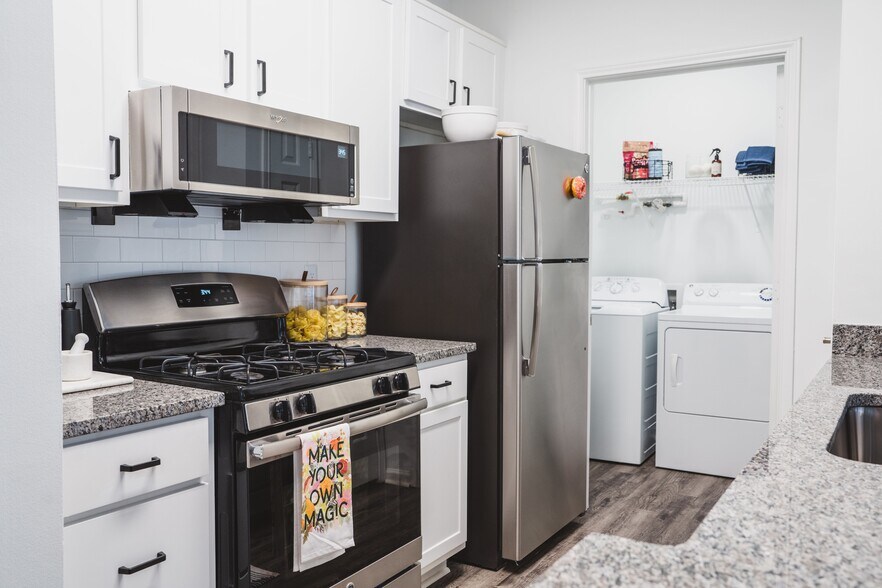 Renovated kitchen with energy-efficient stainless-steel appliances - Alister Lake Lynn