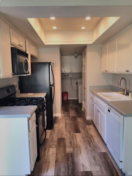 Inside laundry room with pantry. - 18681 Maplewood Cir