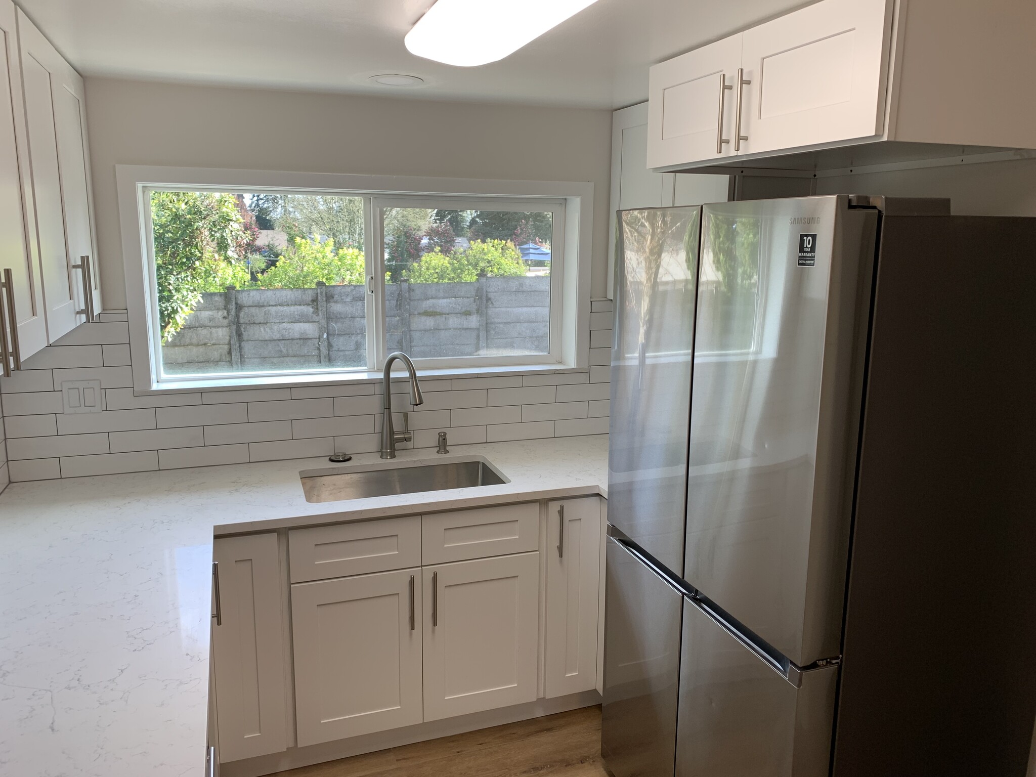 New Kitchen with Tile, Stone Countertops and Stainless Steel Appliances - 4018 NE 54th Ave