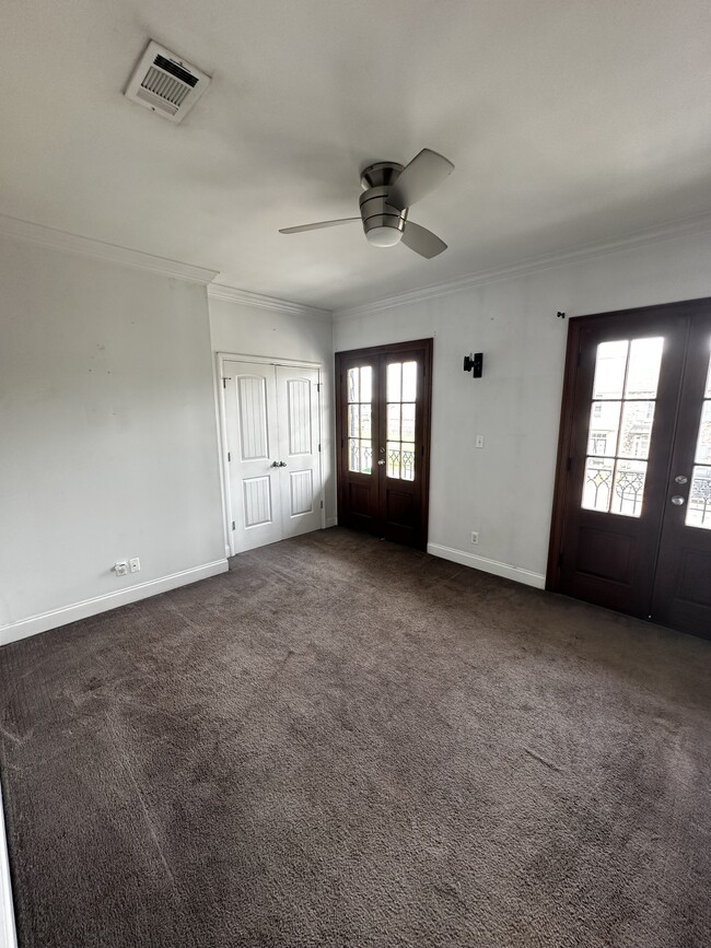 Guest Bedroom #1 with balcony entrance - 513 Cliff Bullock Dr