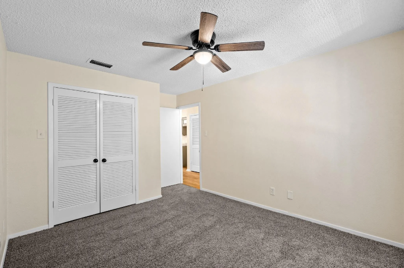 Bedroom 1 with walk-in closet - 1206 Riverchase Ln