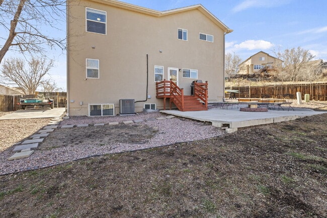 Building Photo - Spacious Home with Finished Basement, Granite Kitchen & Fenced Yard Near Fort Carson